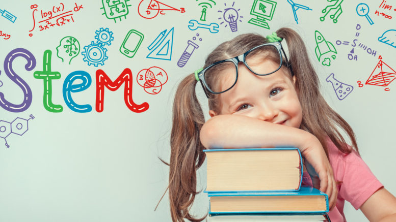 STEM word and symbols over beautiful cute little girl with books. modern education concept